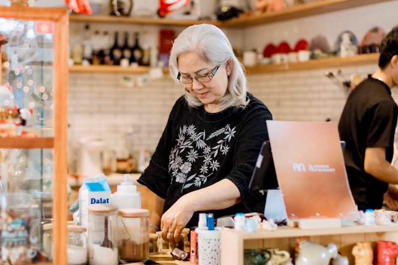 Cafe owner working behind the counter
