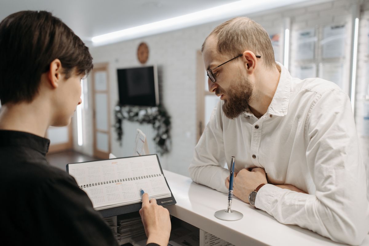 Receptionist confirming an appointment with a client
